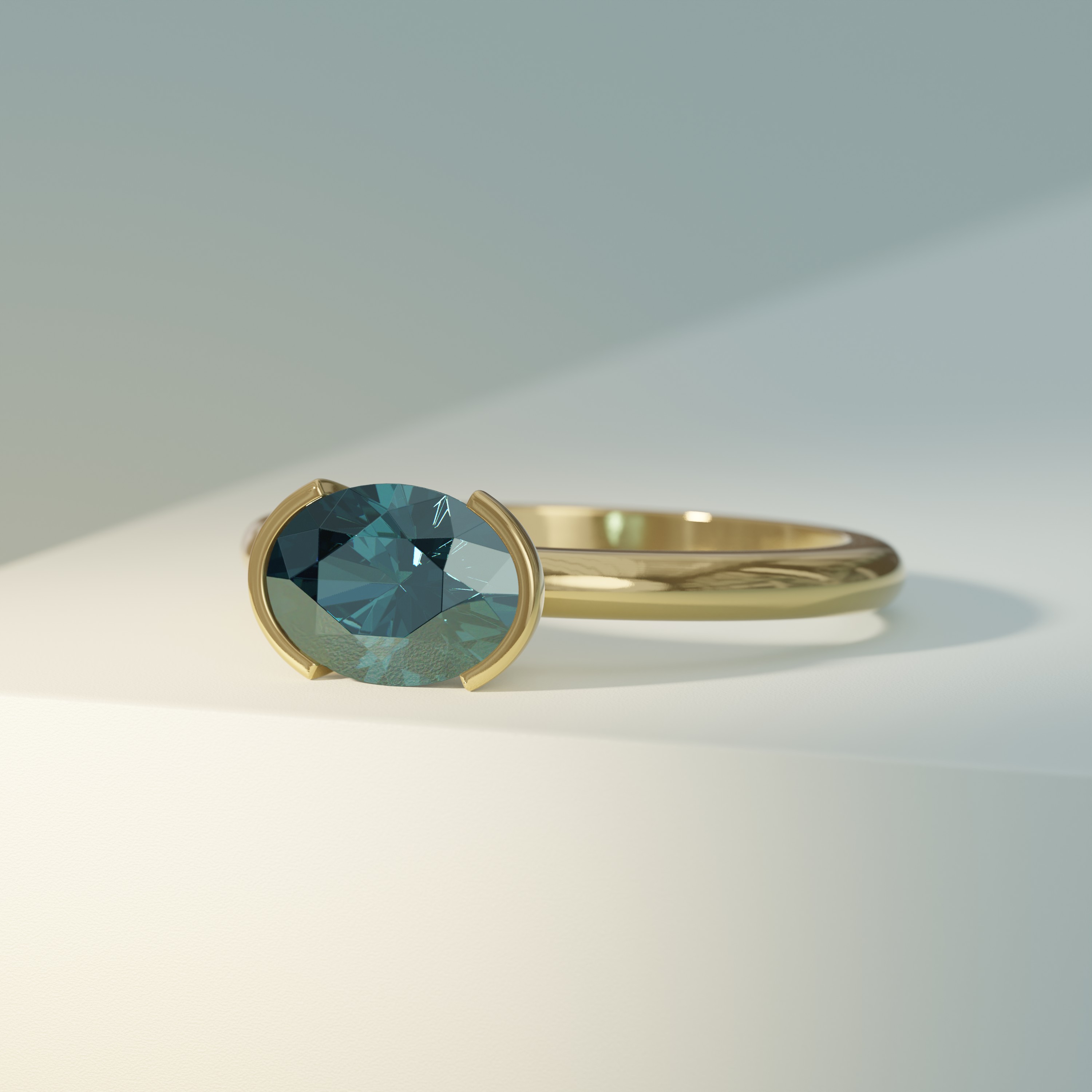 Green East-West Oval Solitaire with Half Bezel