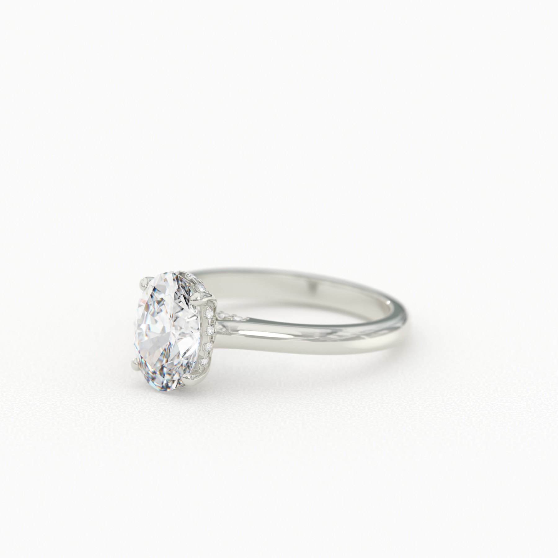 Four-Prong Oval Cut Solitaire with Hidden Halo