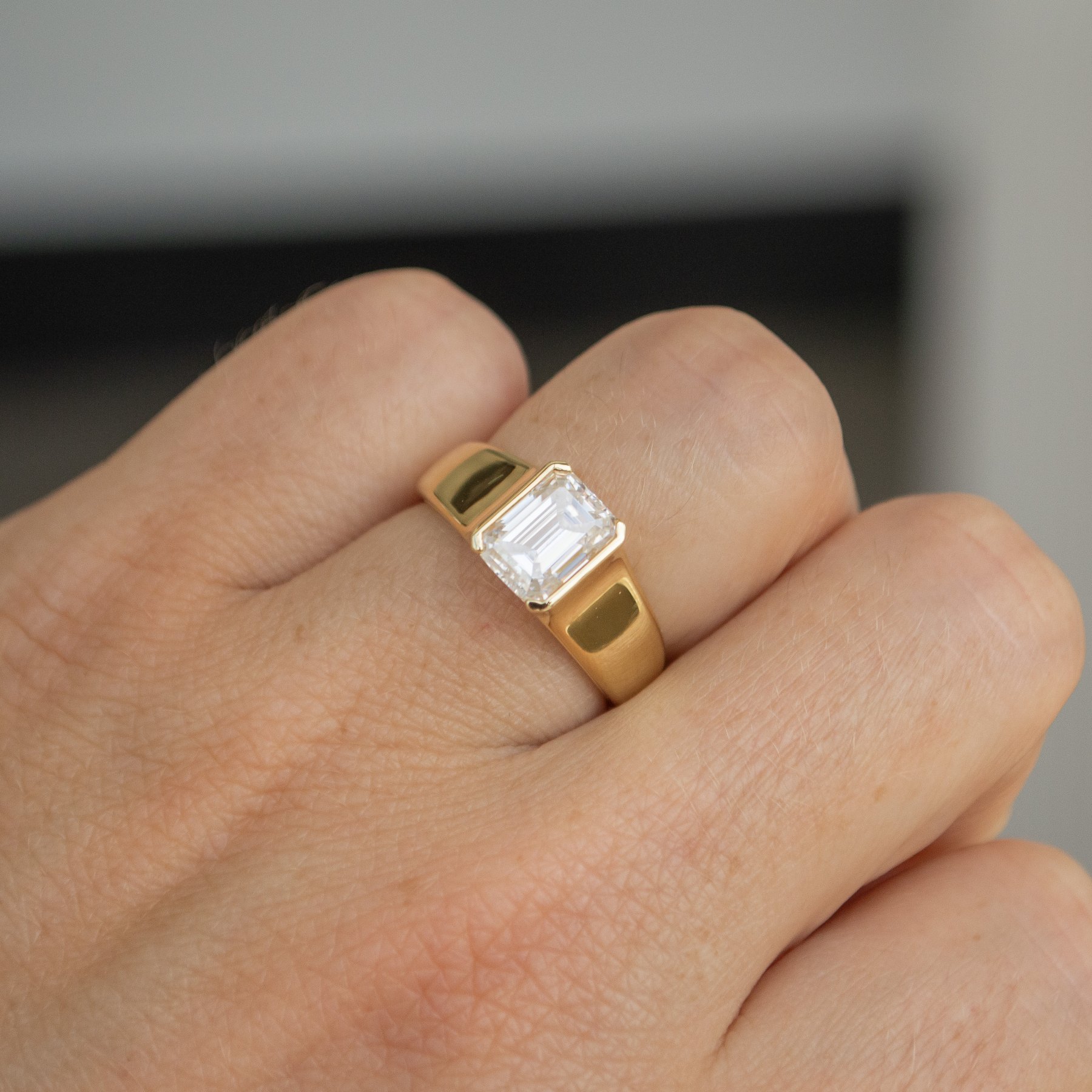 Emerald Cut Solitaire with Wide Half-Signet Band Engagement Ring