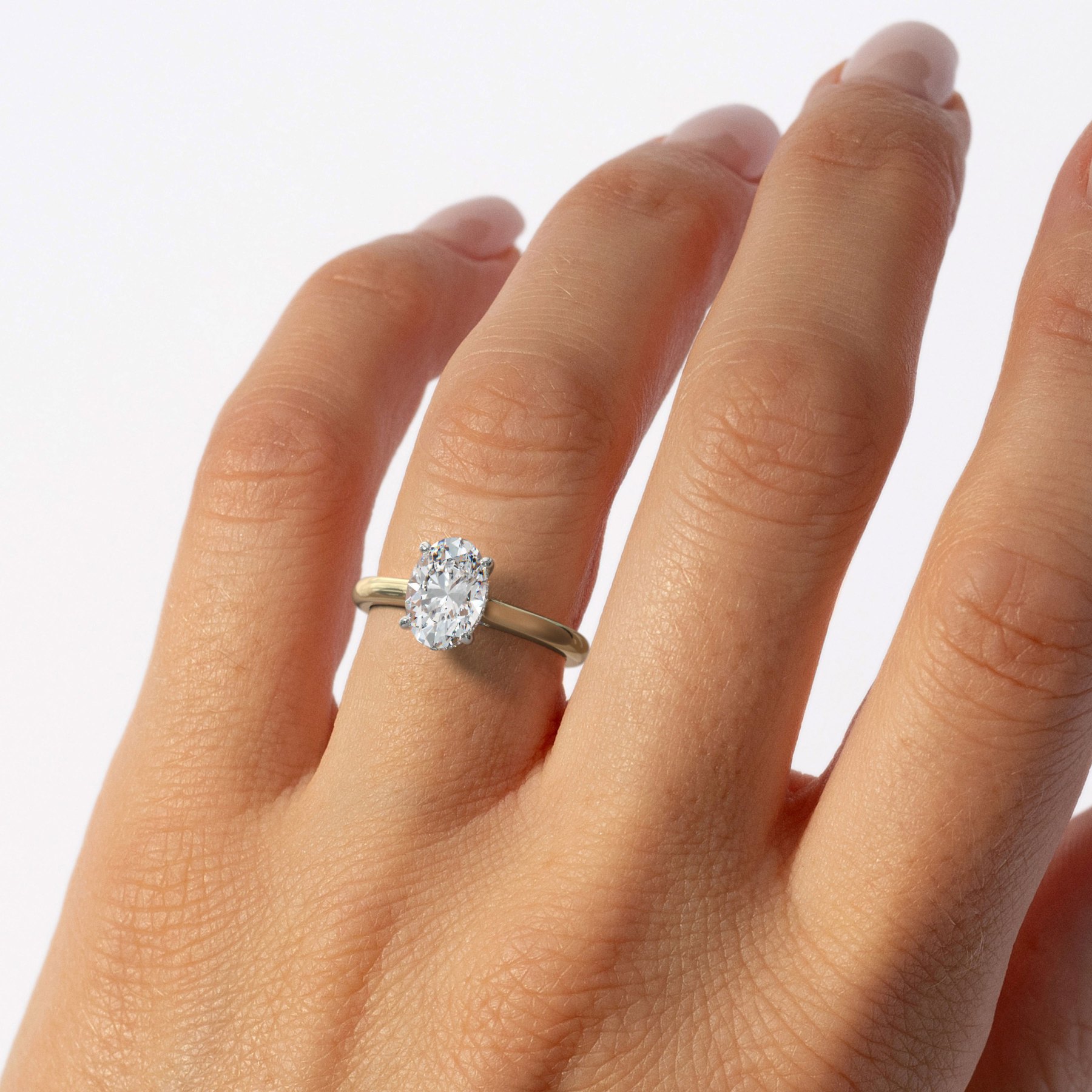 Four-Prong Oval Cut Solitaire with Hidden Halo Engagement Ring