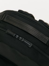 Backpack with detachable pouch