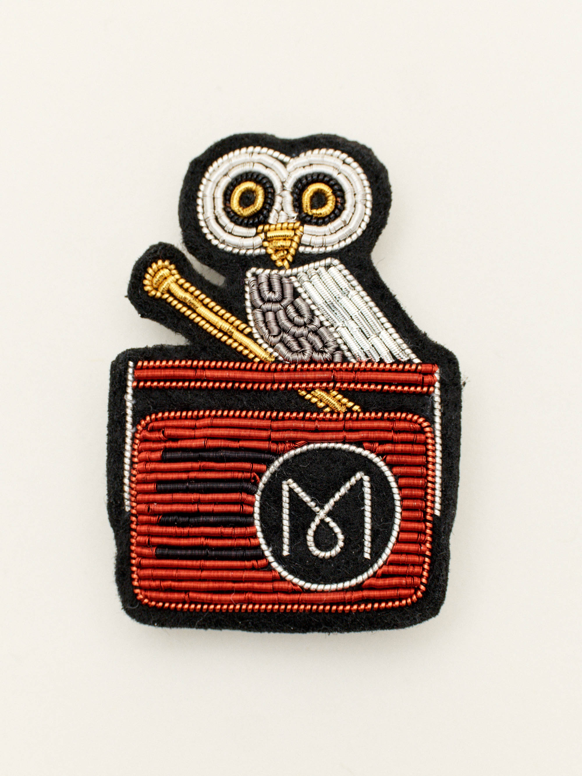 Monocle Radio brooch 